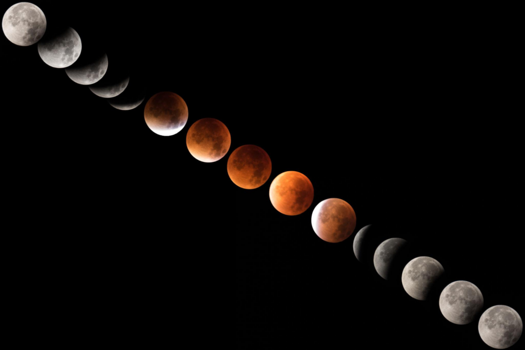 Total lunar eclipse showing the Moon fully immersed in Earth’s shadow with a deep red blood moon glow.