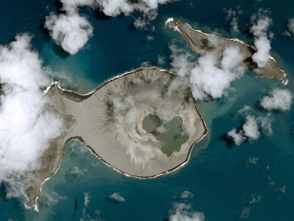 Temporary volcanic island formed by a submarine eruption at Kavachi, with ash and steam rising above the ocean surface.